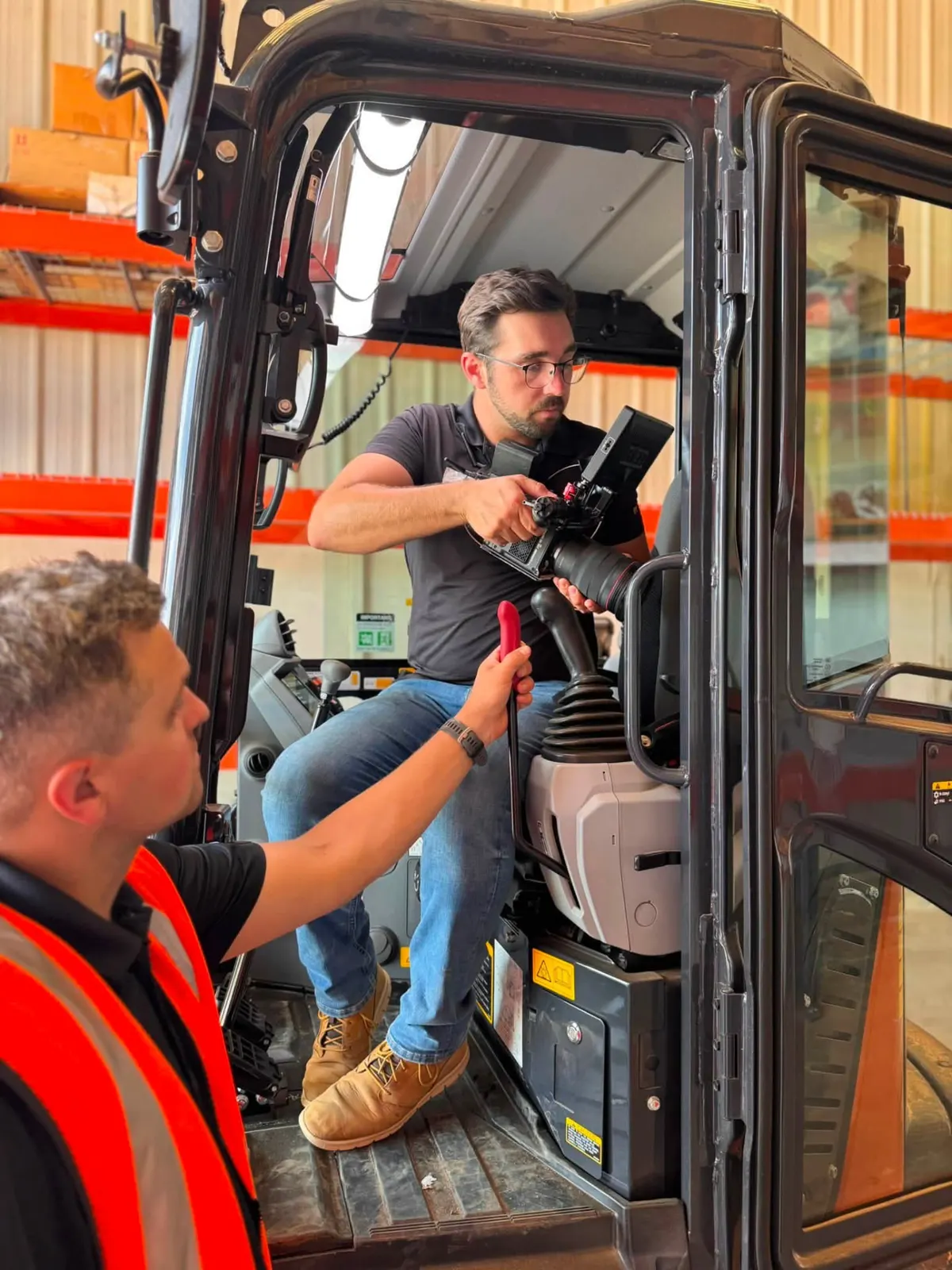 Filming an operator inside heavy equipment