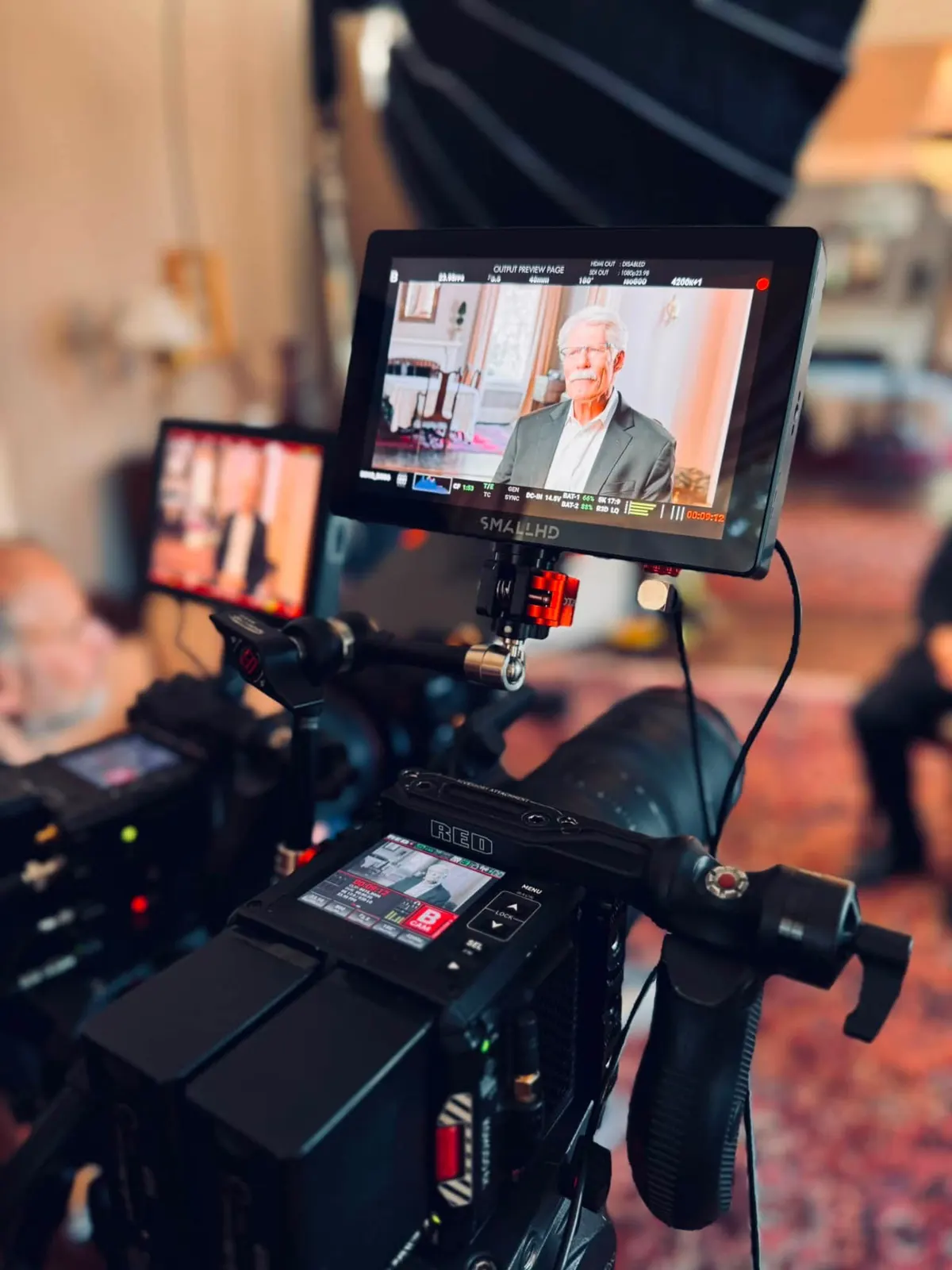 Monitor and camera rig during a sit-down interview